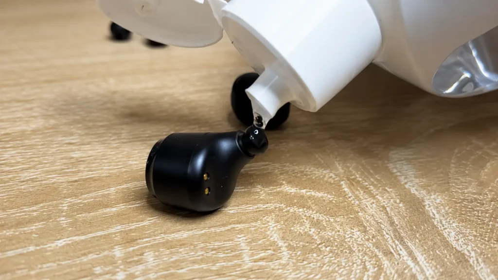 Applying cleaning solution to a wireless earbud
