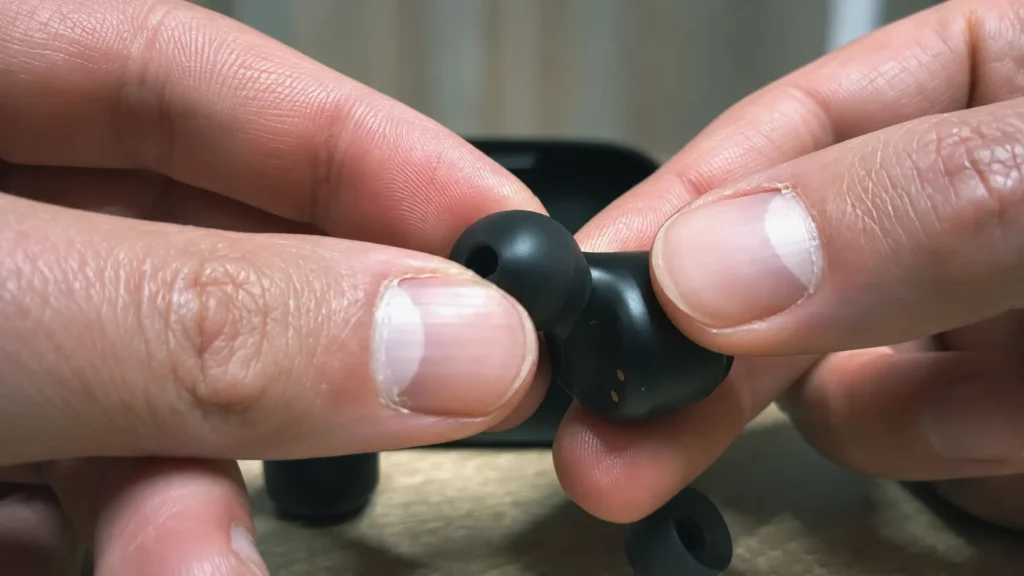 Removing the silicone ear tip from a wireless earbud