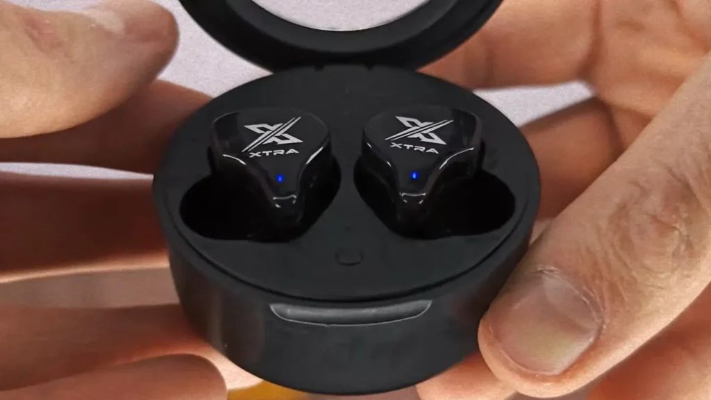 Bluetooth earbuds in a charging case ready to connect to a Windows PC