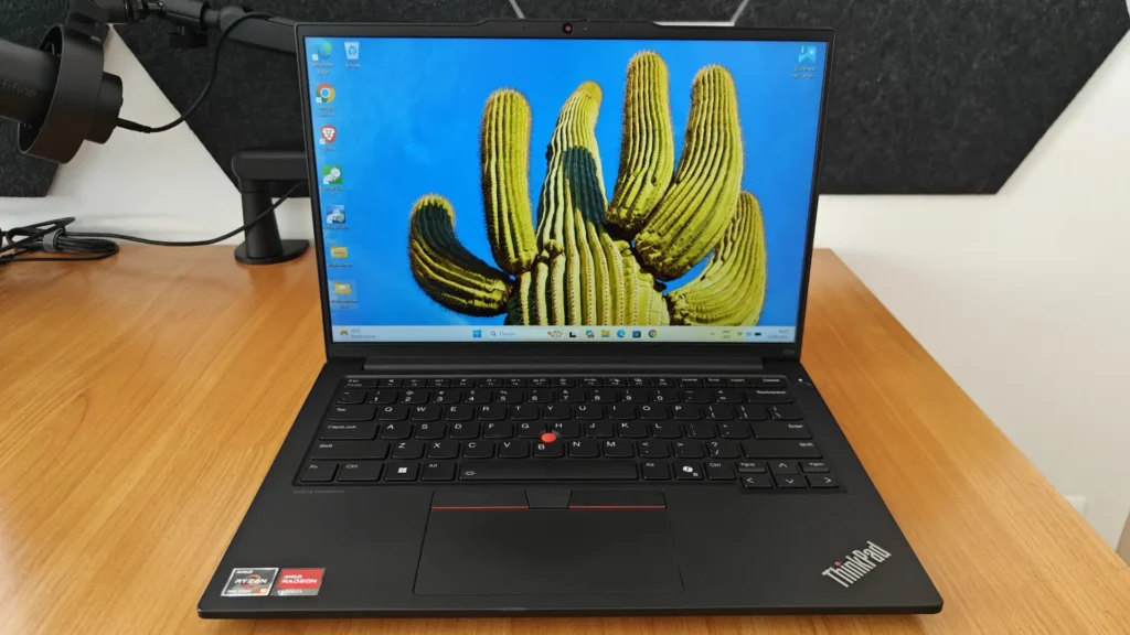 Lenovo ThinkPad E14 Gen 6 AMD laptop with a 14-inch IPS display showing a colorful cactus wallpaper.